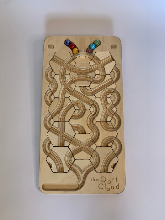 The Oort Cloud: A Marble Run Puzzle Game
