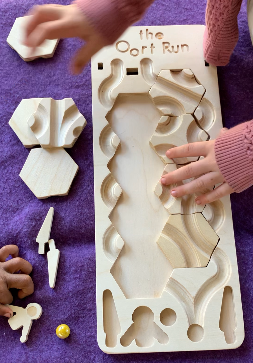 The Oort Run: A Marble Run Puzzle Game
